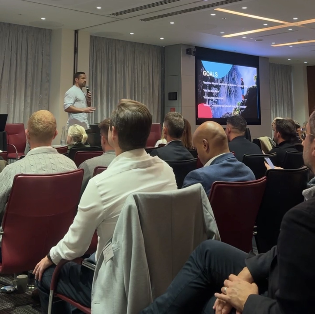 Elliot Awin presenting at a corporate engagement — goals session